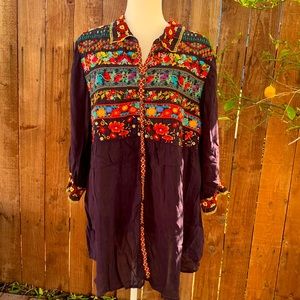 Johnny was women’s purple blouse with floral embroidery size large